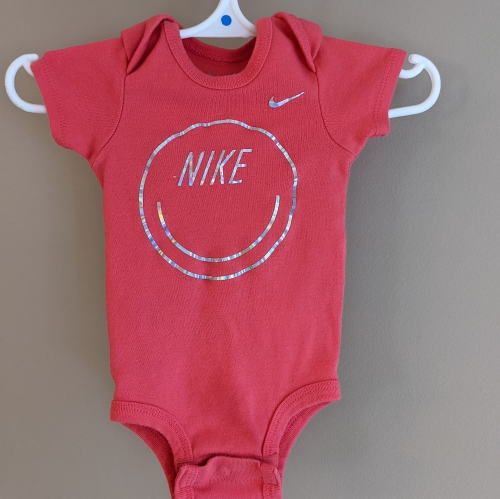 Nike dark pink smiley face onesie/bodysuit